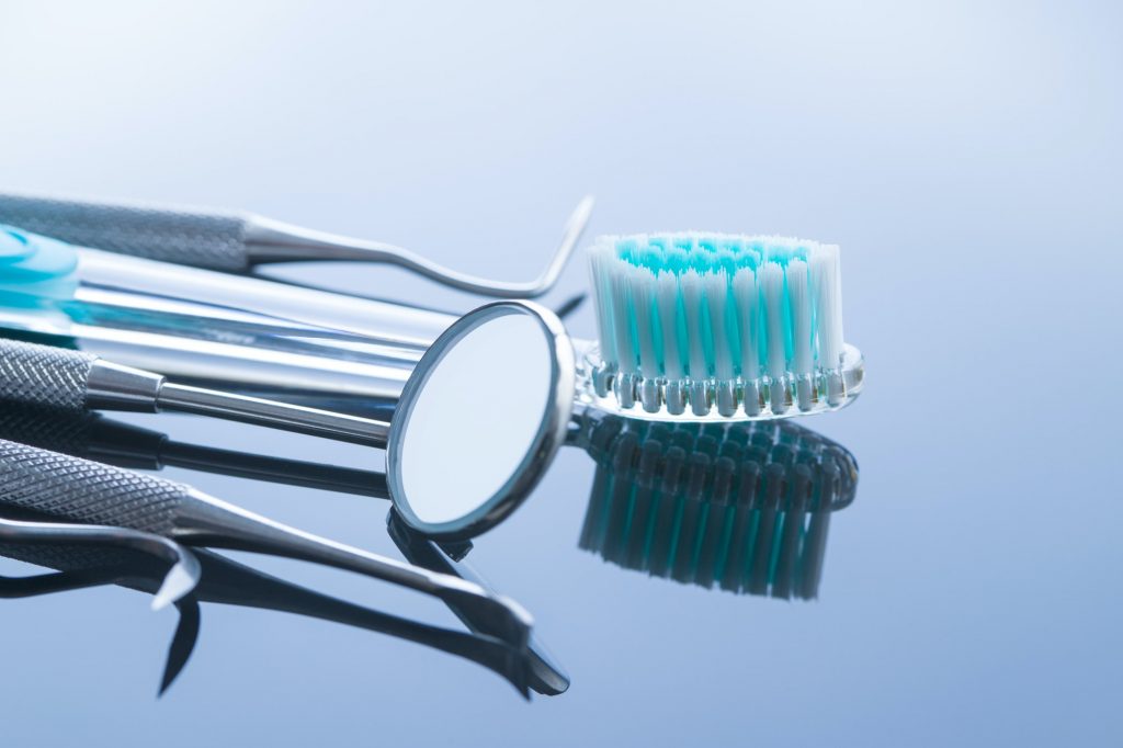 Dental instruments. Dentists tools and toothbrush.